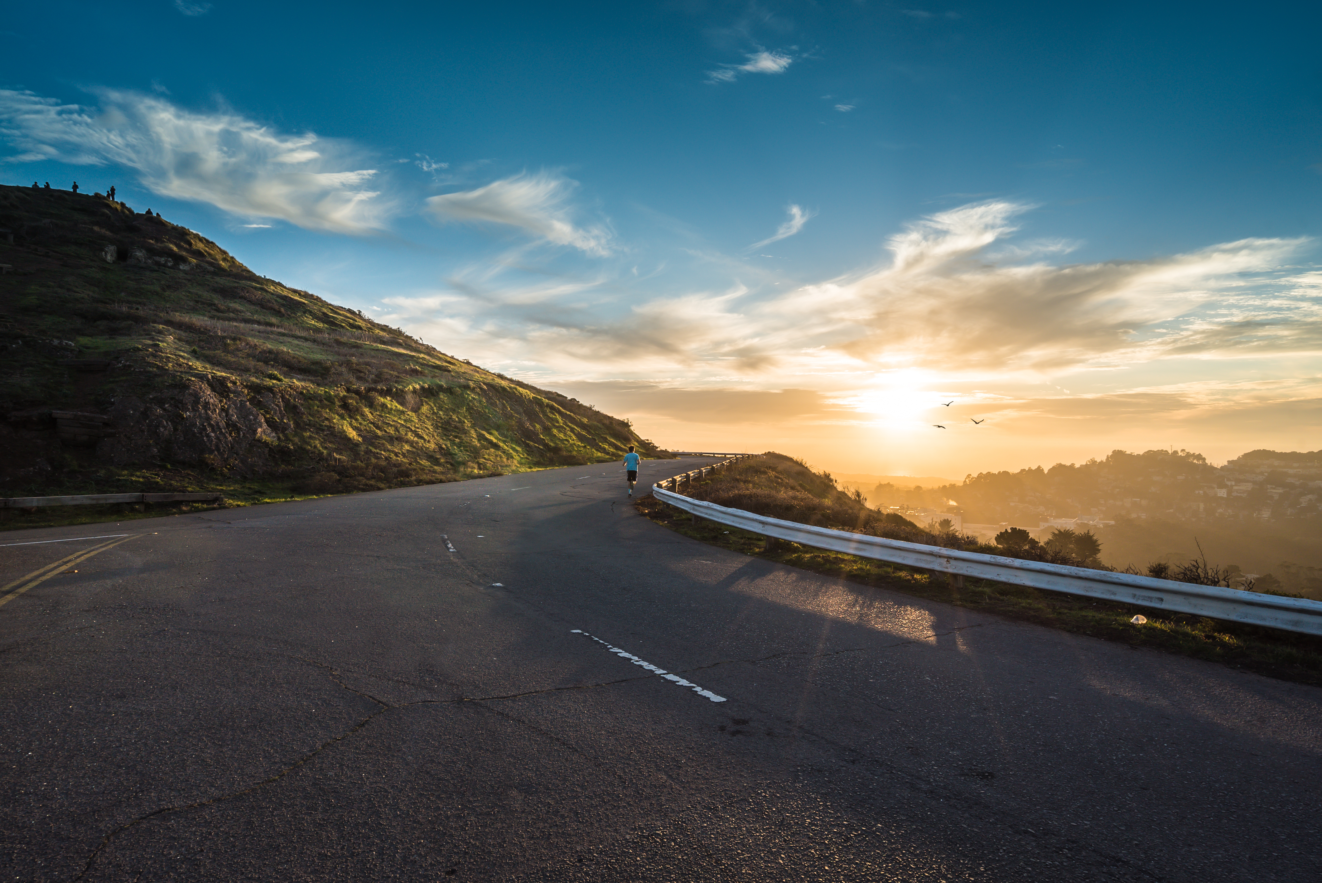 Runner at sunset on California hills
